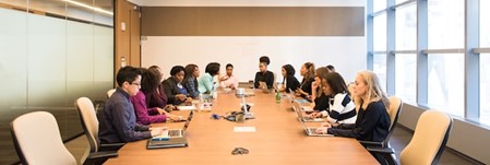 Women working around conference table