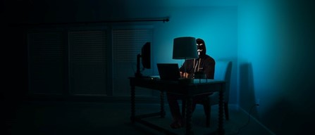 A hacker working on a laptop